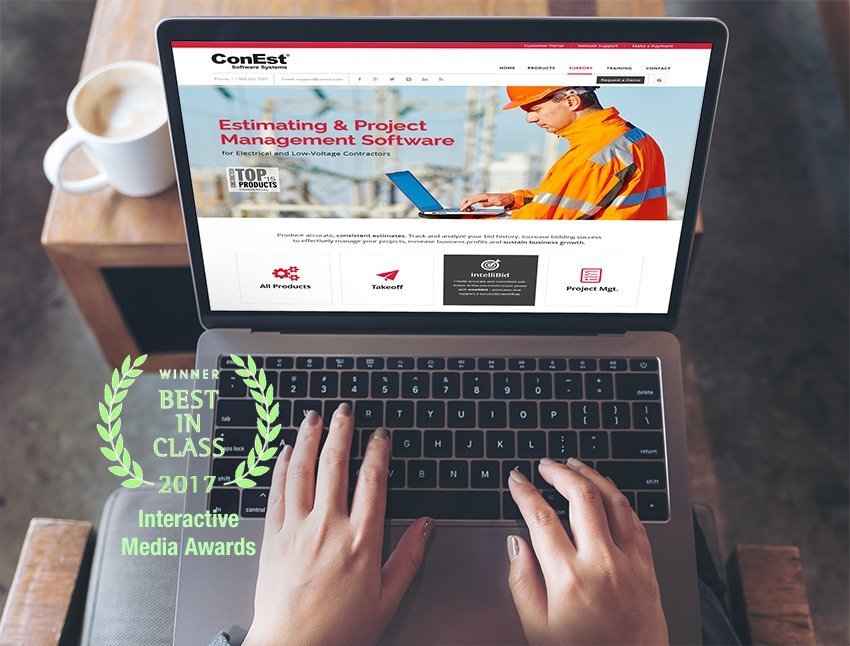 A laptop with the award-winning website design for ConEst Software.