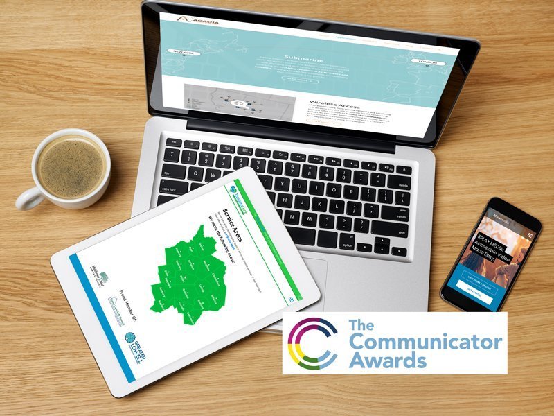 Three award 2018 Communicator Award winning projects on a smartphone, tablet and desktop.