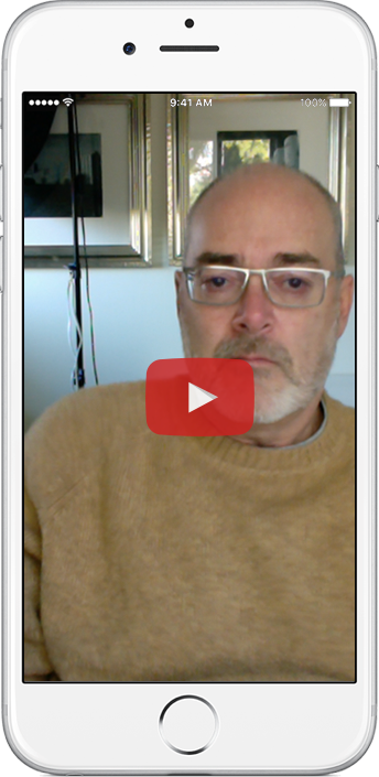White iPhone with image of Robbie Moore, founder of Rushminute in a brown sweater.